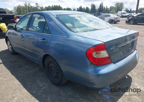 2003 Toyota Camry Le z USA, uszkodzony, nr VIN JTDBE32K130182354
